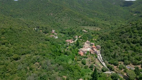 Third of six videos of a small town in the middle of mountains Video stock 245374013