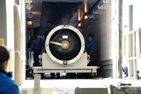The third stage of the Orbital ATK Pegasus XL rocket is offloaded from a tr.. 스톡 사진
