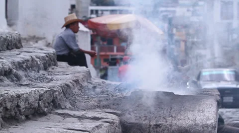 Third world country. Man is sitting in the smoke 1 Stock Footage 33731877