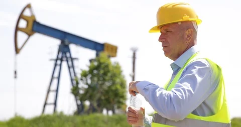 Thirsty Engineer Drink Chill Water at Workplace in Oil Extracting Platform Video stock 103261231
