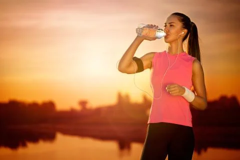 Thirsty female runner Stock Photos