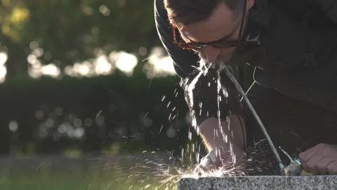 Thirsty man drink cold fresh water from fountain. Person quench thirst outdoor. Stock Footage 276413033
