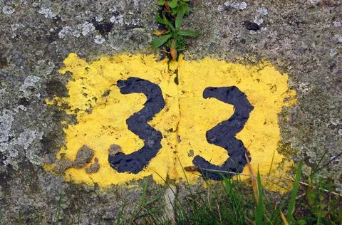 Thirty Three painted on stone Stock Photos