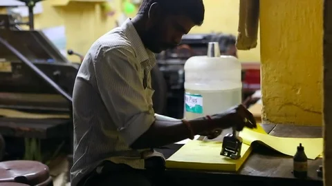 Thiruvanomalai, India  DEC, 2016: The Indian man stamping the forms. Stock Footage 77791244