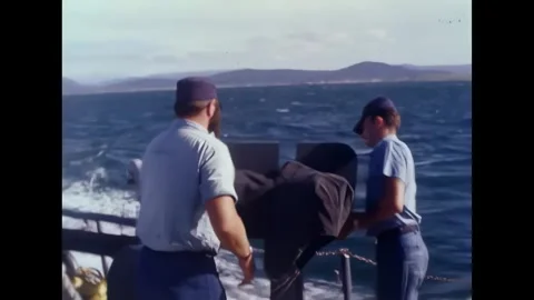 AN THOI - 1965 - Captain John T. Shepherd fires a .45 caliber submachine gun off Stock Footage 341862698