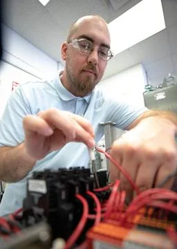 Thomas Cauvel, an intern assisting with software/electrical engineering on... 写真素材