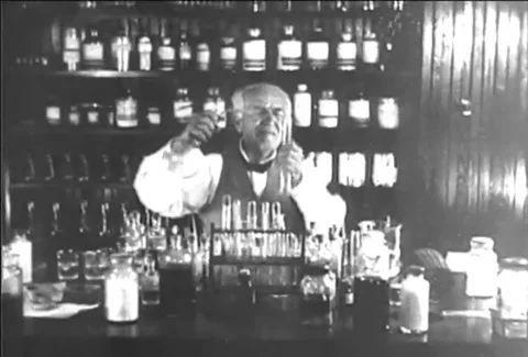 Thomas Edison working in laboratory circa 1920 Видео 119939575
