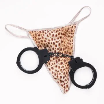 Thong and handcuffs Stock Photos