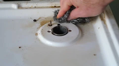  Thorough Cleaning: Detailing Progress on a Gas Stove Stock Footage 274583025
