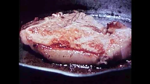 Thorough cooking is required to kill the parasite Trichonisis in pork in the Stock Footage 101200733