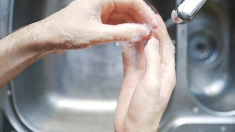 Thorough hand wash with rinse Stock Footage 128959816