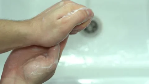 Thorough hand washing with soap close-up on the background of the sink Stock Footage 149231373