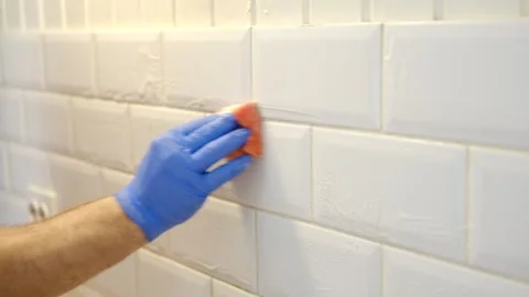 Thoroughly cleaning the grout between tiles Stock-Footage 334366904