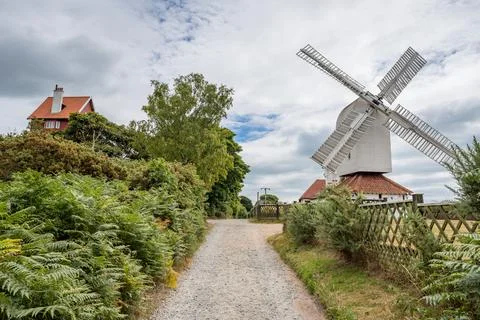 Thorpeness windmill next to the House in the Clouds Stock Photos