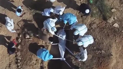 Those killed by covid 19 are buried. India 6 Video stock 155362011
