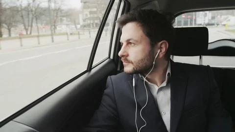 Thoughful Businessman Looking Through a Window Stock Footage 74760362