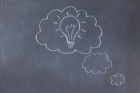 Thought clouds with light bulb on chalkboard Stock Photos