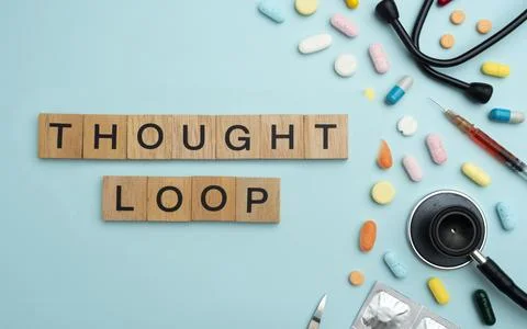 Thought Loop word on wooden blocks with prescription pills and stethoscope .. Фото