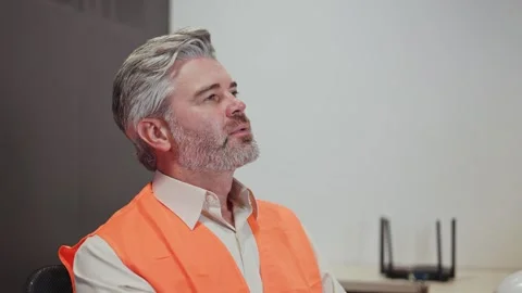 Thought male engineer taking off glasses and looking in distance at workplace Stock-Footage 255011683