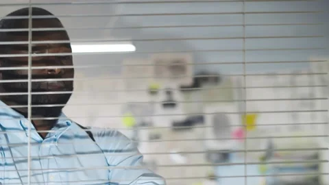 Thoughtful african policeman concentrating on developing ideas of crime proof Stock Footage 142810691