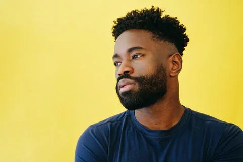 Thoughtful Afro Man With Beard Looking Away Stock Photos