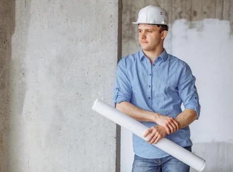 Thoughtful attractive guy is holding a draft Stock Photos