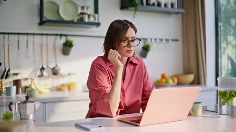 Thoughtful author texting computer writing ideas kitchen closeup. Woman studying Stock Footage 335150486