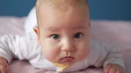 Thoughtful Baby Looking Attentevly To The Camera. Close Up Portrait Stock Footage