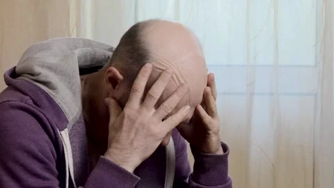 Thoughtful Bearded Man Desperately Thinking and Holding Hands in Deep Thought Stock Footage 338274082