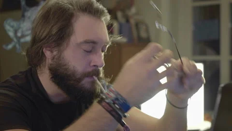 Thoughtful Beardy Man Drinking and Smoking on PC Video stock 143187176