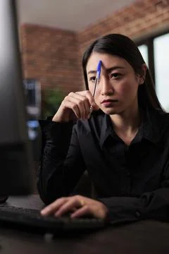 Thoughtful blockchain developer reflecting at low levels of security Stockfoto's