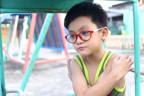 Thoughtful Boy in Playground Setting Stock Photos