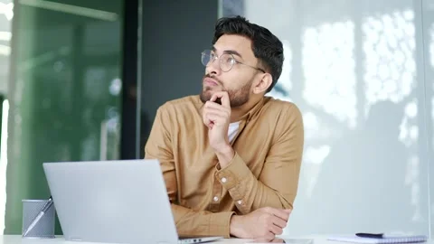 Thoughtful businessman thinking about problem solving while working on a laptop  Stock Footage 276433926