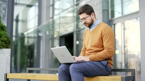 Thoughtful businessman thinking about problem solving while working on laptop  Stock Footage 321288796