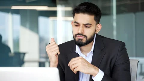 Thoughtful businessman thinking about solving a problem while working in busines Stock Footage 318217856