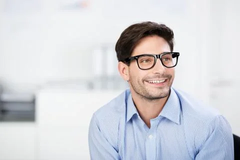 Thoughtful businessman wearing glasses while looking away Stock Photos