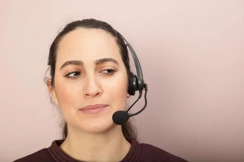 Thoughtful call center operator taking a cal Stock Photos