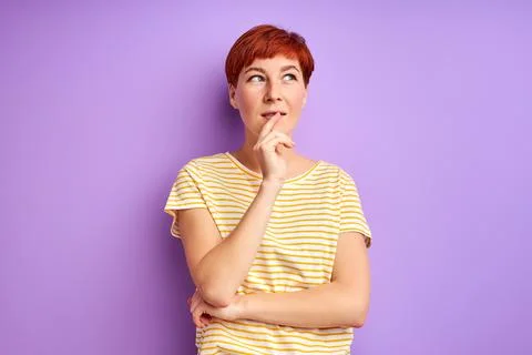 Thoughtful caucasian female with red hair stand thinking Stock Photos