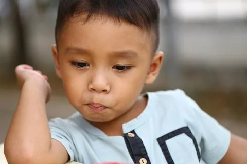 Thoughtful Child with Pensive Expression Stock-Fotos