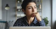 Thoughtful Concerned Indian Woman Working On Computer Thinking Solving Problem Stock Footage