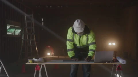 Thoughtful Construction Worker Draws On Paper At Desk Video stock 270388930
