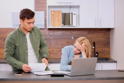 Thoughtful couple solving financial problems in family 写真素材