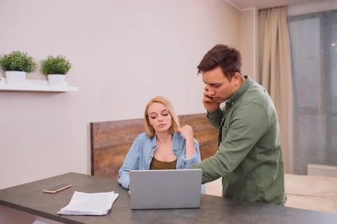 Thoughtful couple solving financial problems in family 写真素材