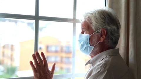 Thoughtful depressed old man looking out of window with hope, thinking over.. Stock-Footage 231622507