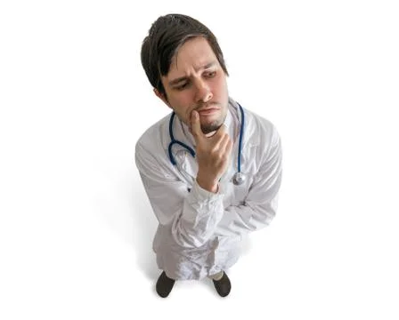 Thoughtful doctor is thinking and solving a problem. Isolated on white backgr Stockfoto's