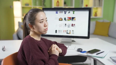 Thoughtful e-commerce owner asian young business woman. Stock Footage 235509112