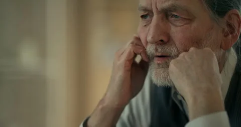 Thoughtful elderly man resting with eyes closed and hands near face Vidéo 336287922