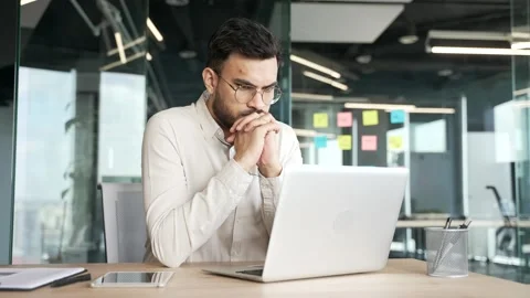 Thoughtful focused businessman thinking about problem solving while working  Video stock 343356465