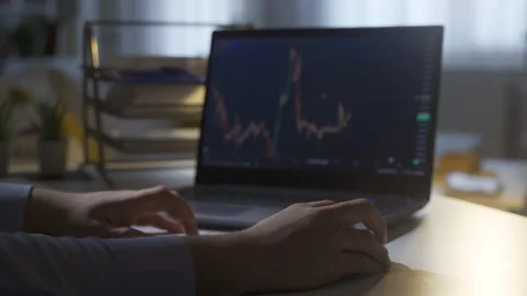 Thoughtful hands analyzing charts in stock market. Stock Footage 219713223