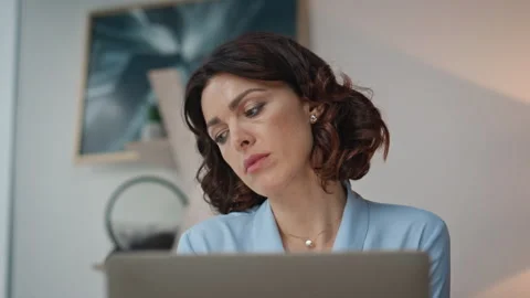 Thoughtful lady working computer reading documents at workdesk office closeup. Stock Footage 280504292